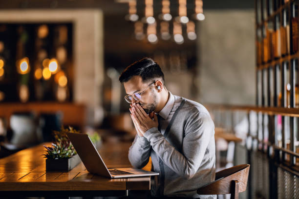 Man sitting at a table brainstorming the vision for Qartelier Fitness Marketplace